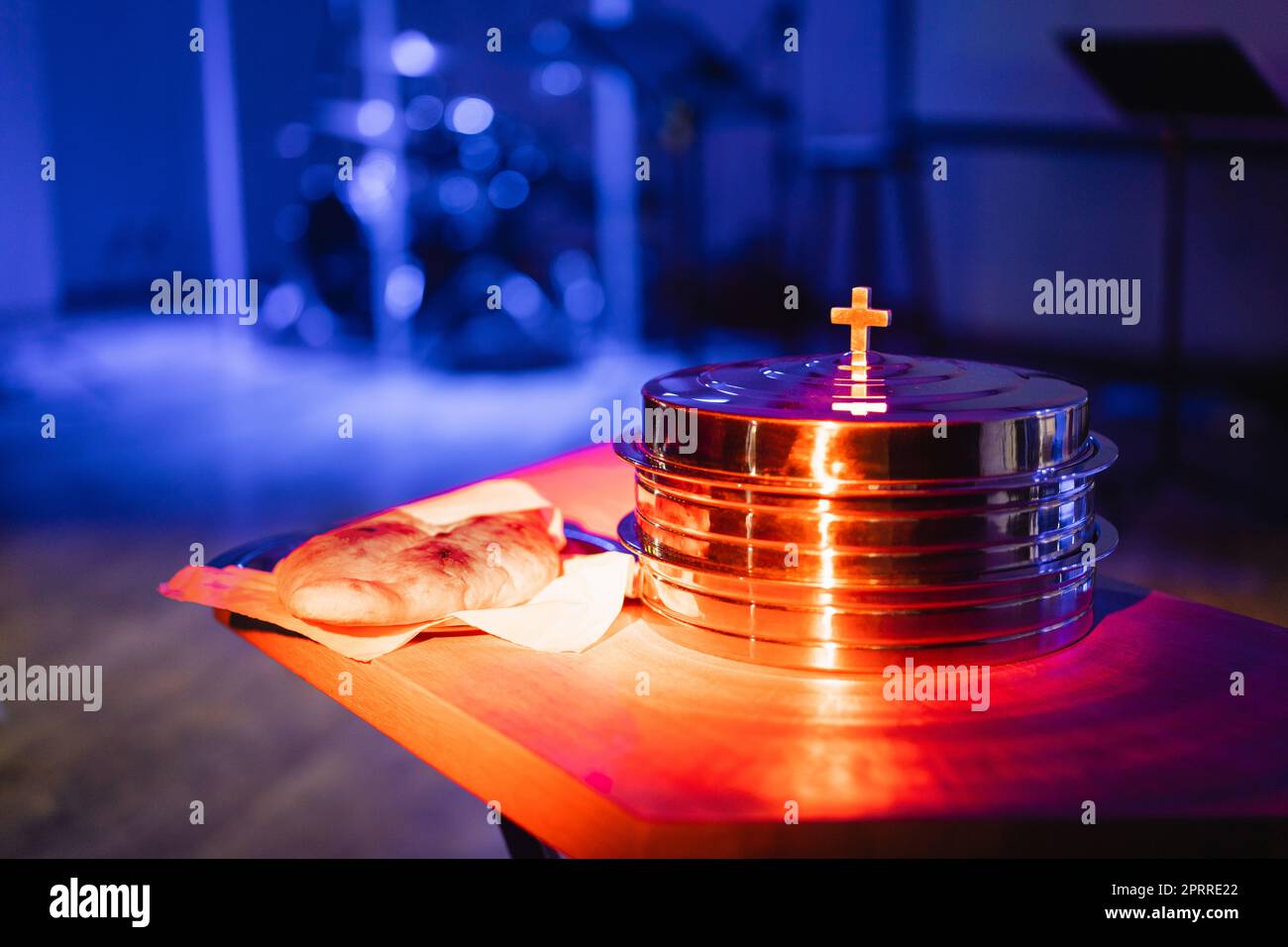 The process of breaking bread in the modern church Stock Photo Alamy