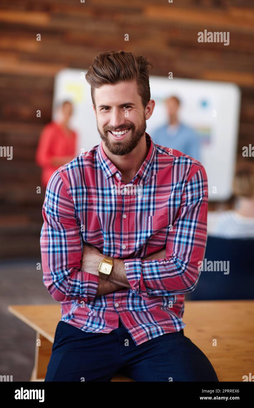 Youre looking at the best man in the biz. Portrait of a young male designer in a casual work environment. Stock Photo