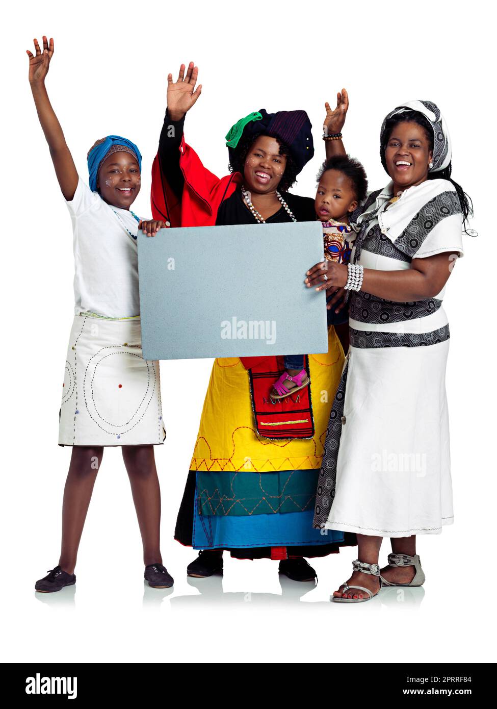 We say yes to community. Studio shot of two african women with their kids holding a blank board, isolated on white. Stock Photo