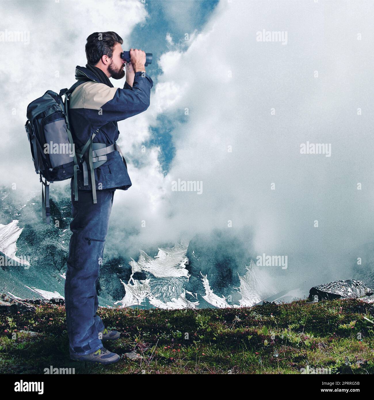 Searching for new challenges. hiker looking through binoculars in a remote landscape. Stock Photo