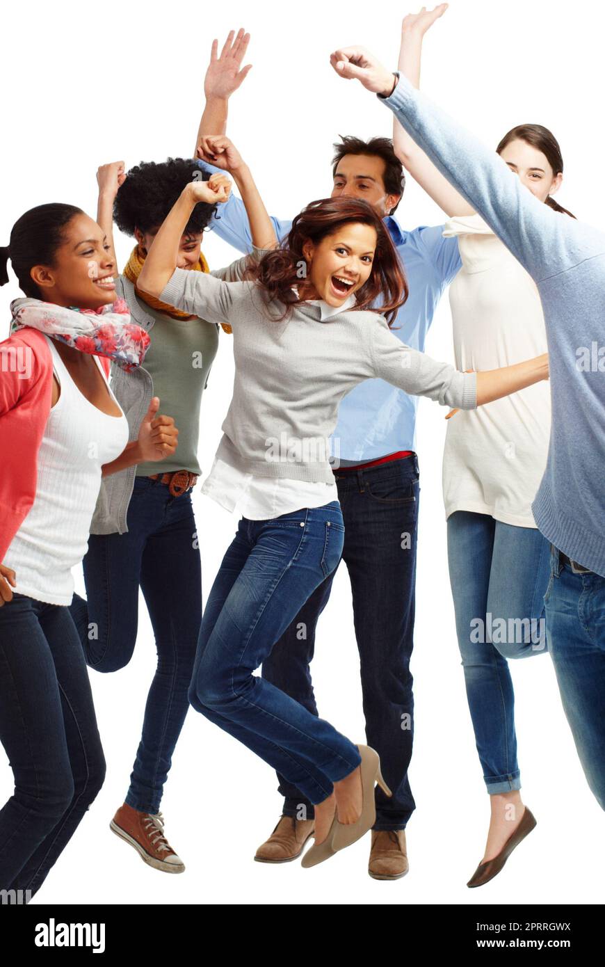 Jumping for joy. Group of casually dressed young adults jumping excitedly against a white background. Stock Photo