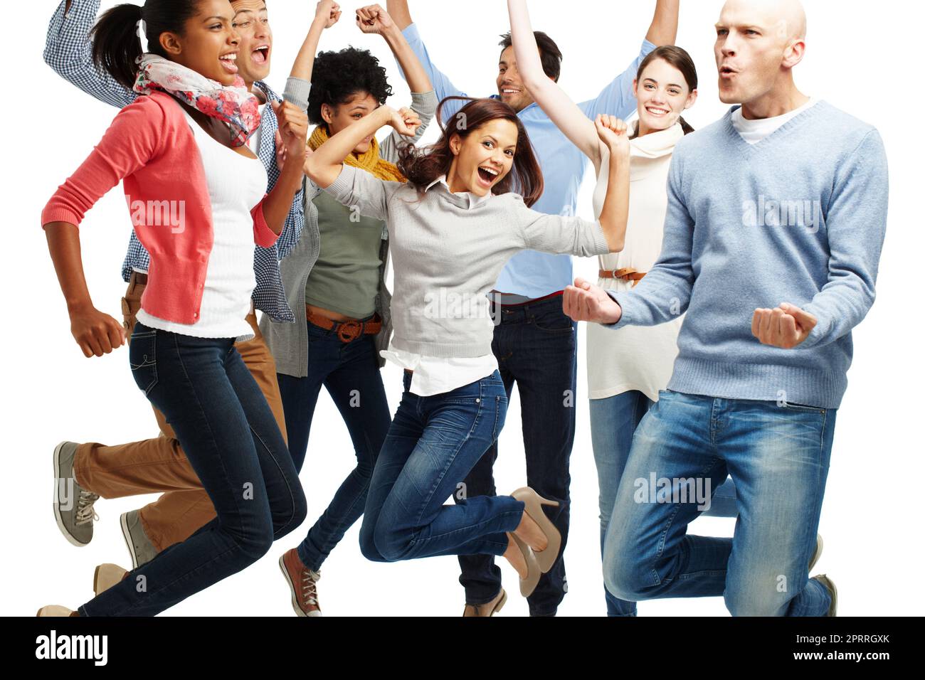 Jumping for joy. Studio shot of a diverse group of vibrant young people jumping into the air isolated on white. Stock Photo