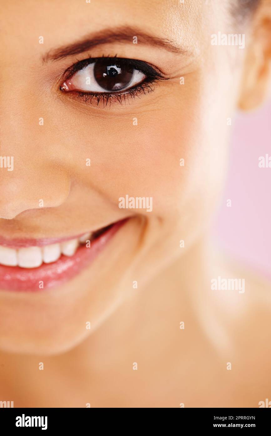 Picture perfect. A close up cropped portrait of a beautiful woman smiling. Stock Photo