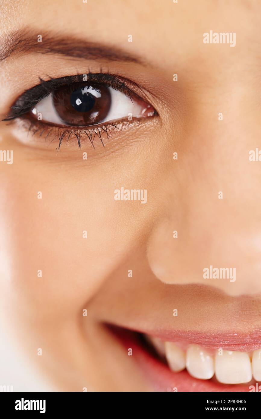 You can see the happiness in her eye. A close up of a happy womans eye. Stock Photo
