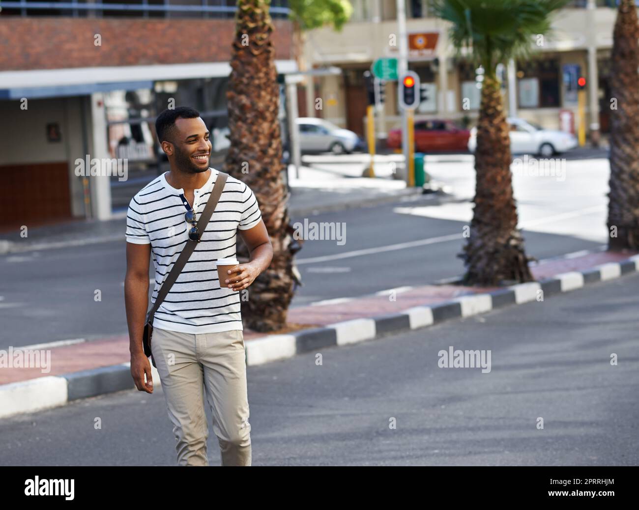 Loving the city vibe. A handsome african american businessman out in the city while on his way to work. Stock Photo