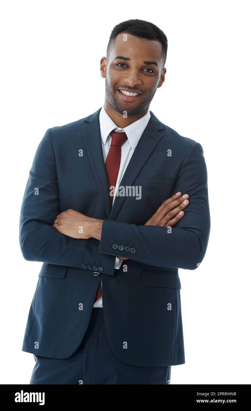 Feeling buoyant about his future. A handsome smiling businessman with his arms folded while isolated on white. Stock Photo