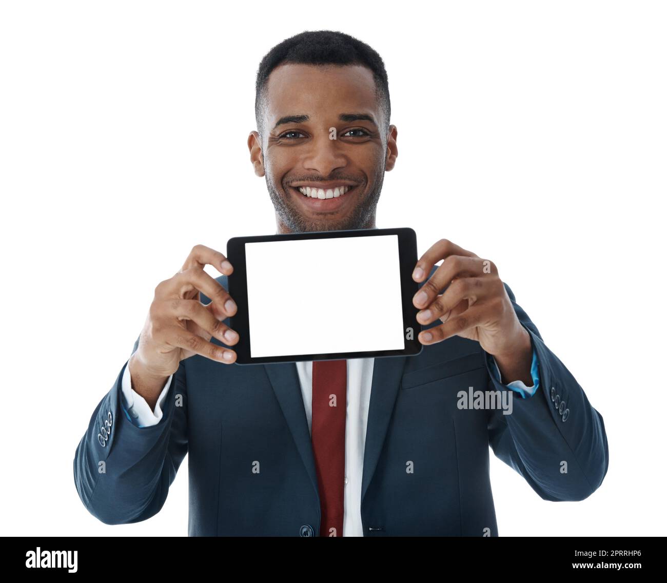 Showing his answer to business needs. A handsome young businessman showing you his digital tablet screen while isolated on white. Stock Photo