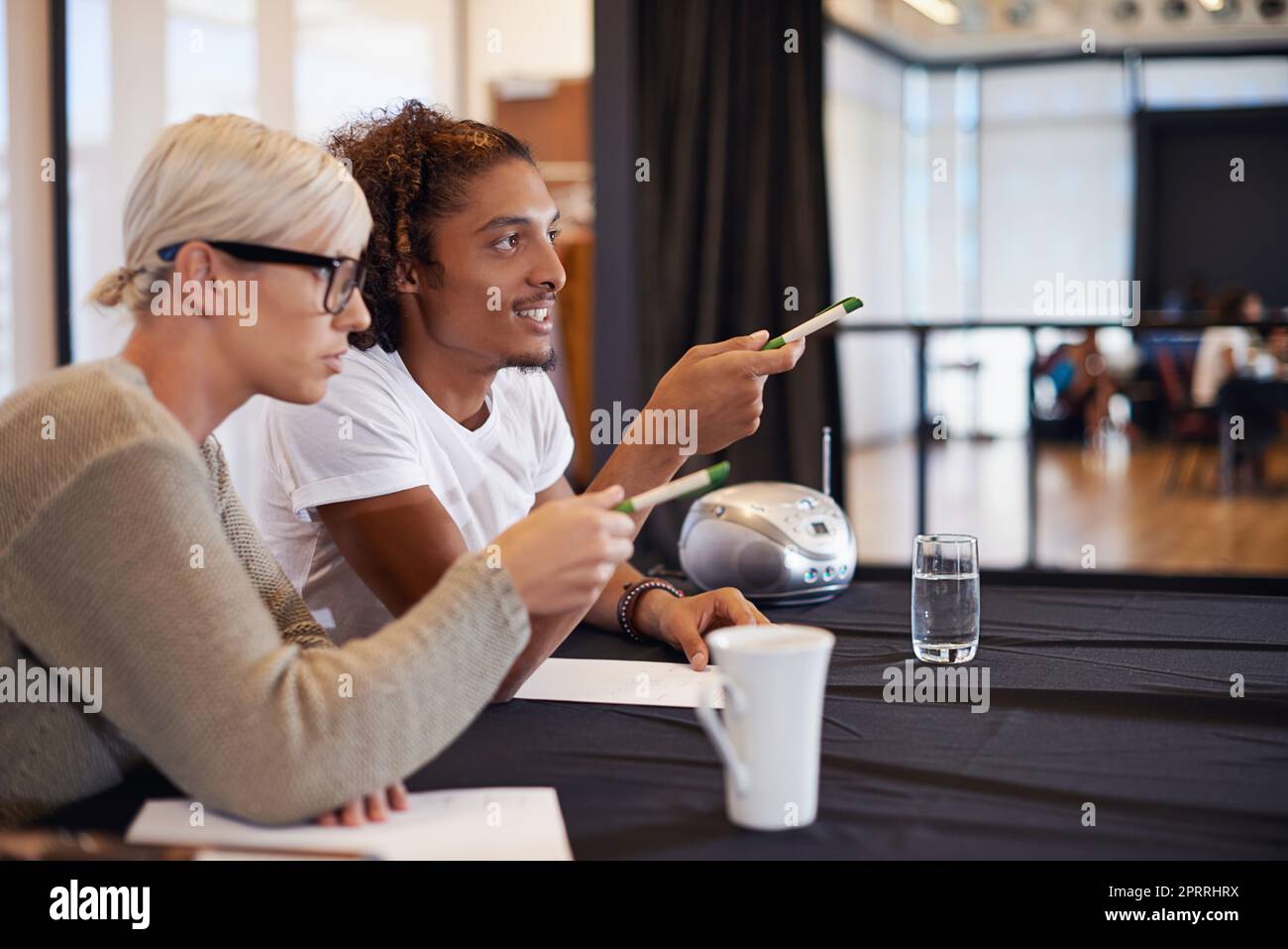 They know what to look for. two judges discussing their decision at a dance audition. Stock Photo