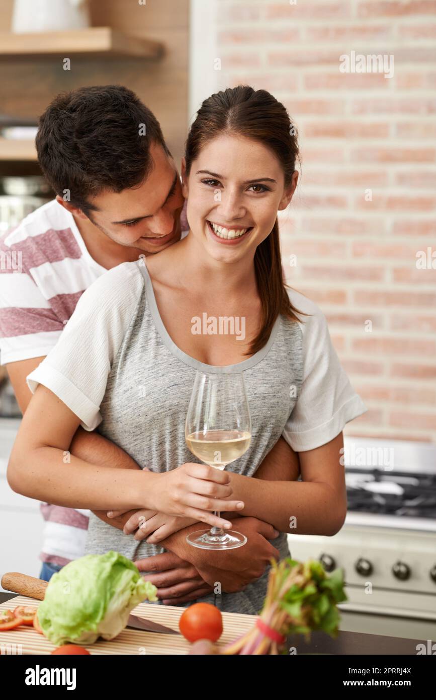 Combining their love for food and each other. Portrait of an attractive young couple bonding in the kitchen. Stock Photo