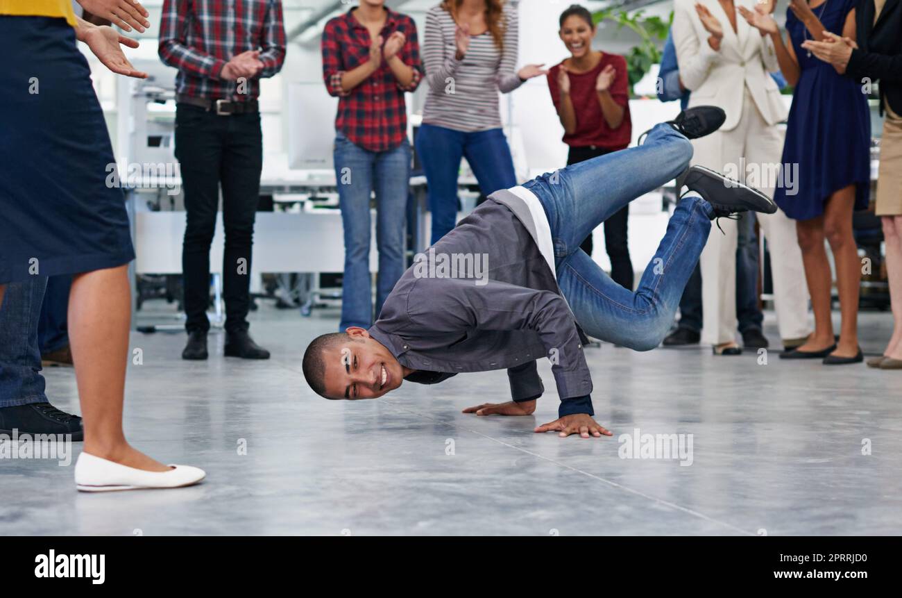 Balancing work and play. an office party with people dancing and having a good time. Stock Photo