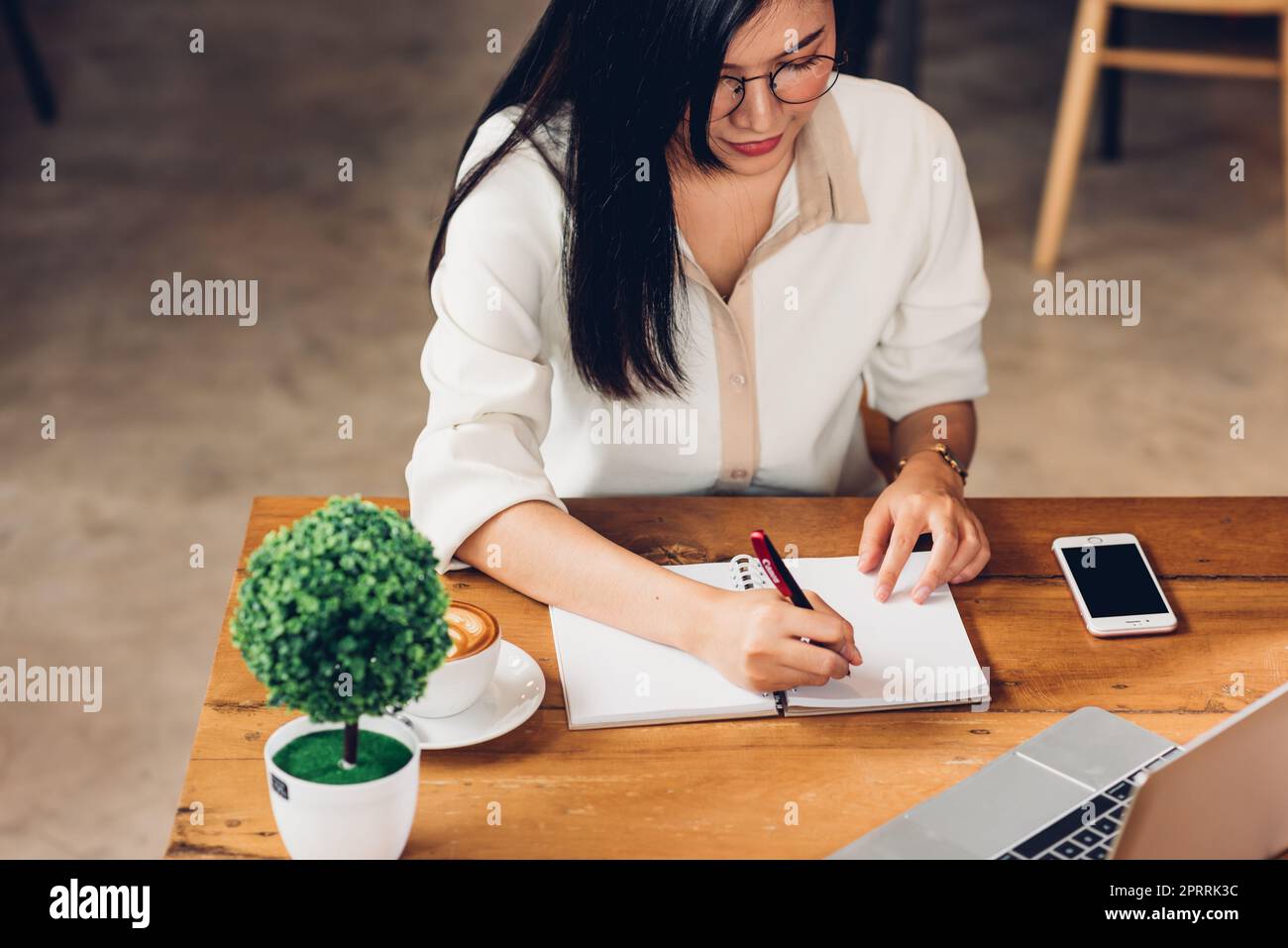 Lifestyle freelance working woman and laptop computer he write book note order Stock Photo