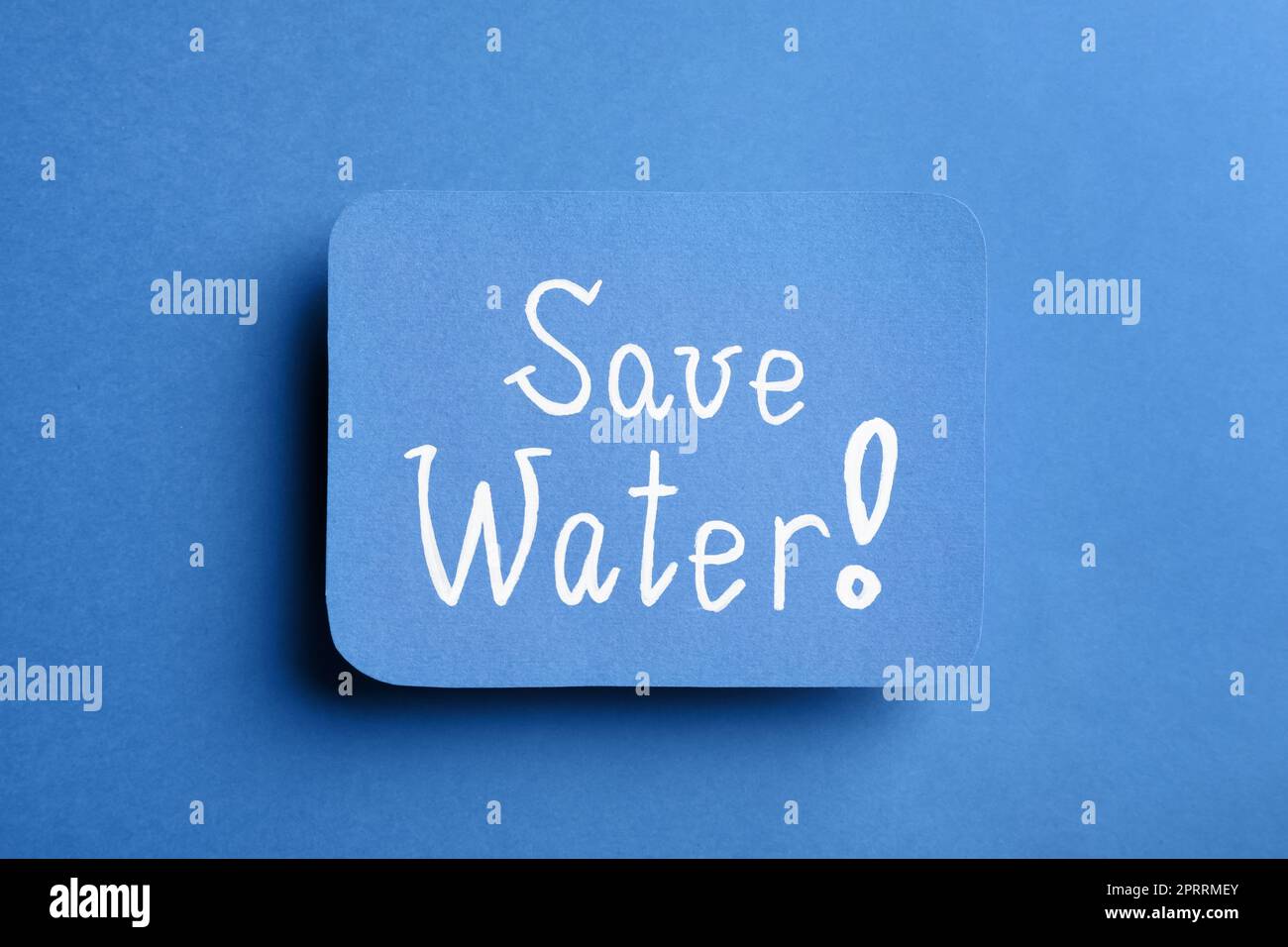 Card with words Save Water on blue background, top view Stock Photo