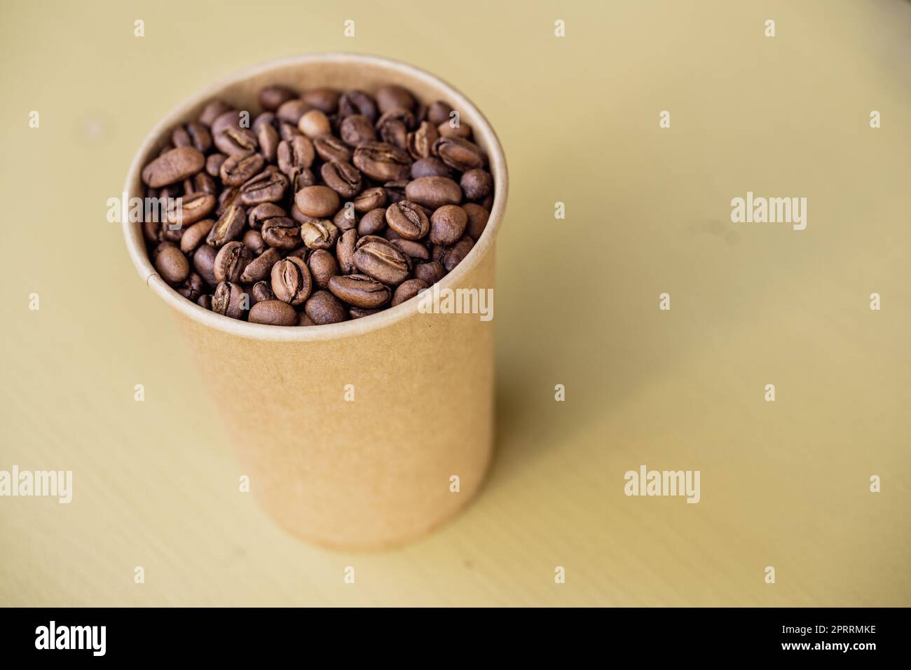 Freshly roasted coffee beans in a cup Stock Photo