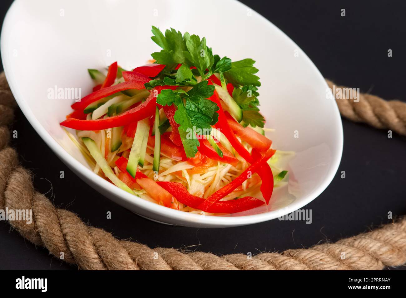 Spring salad with paprika, cucumber and cabbage. Stock Photo