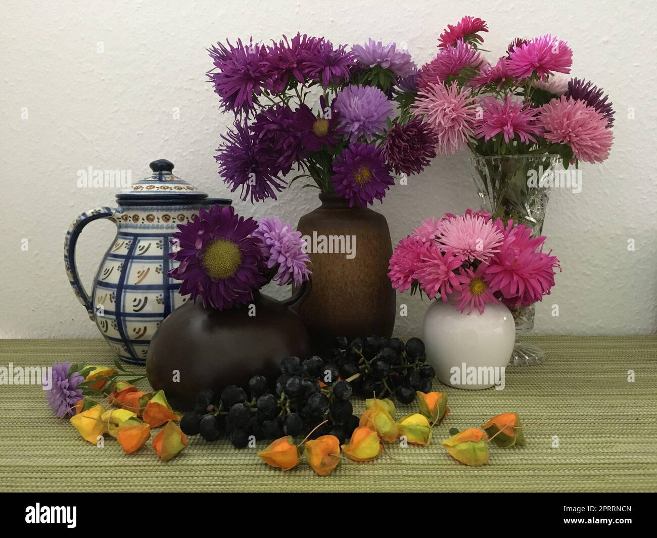 Autumn in the country house with grapes and asters Stock Photo