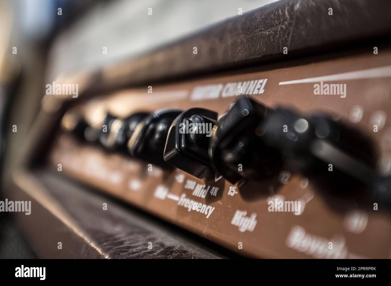 Electric guitar amplifier device leathercovered. Closeup Stock Photo
