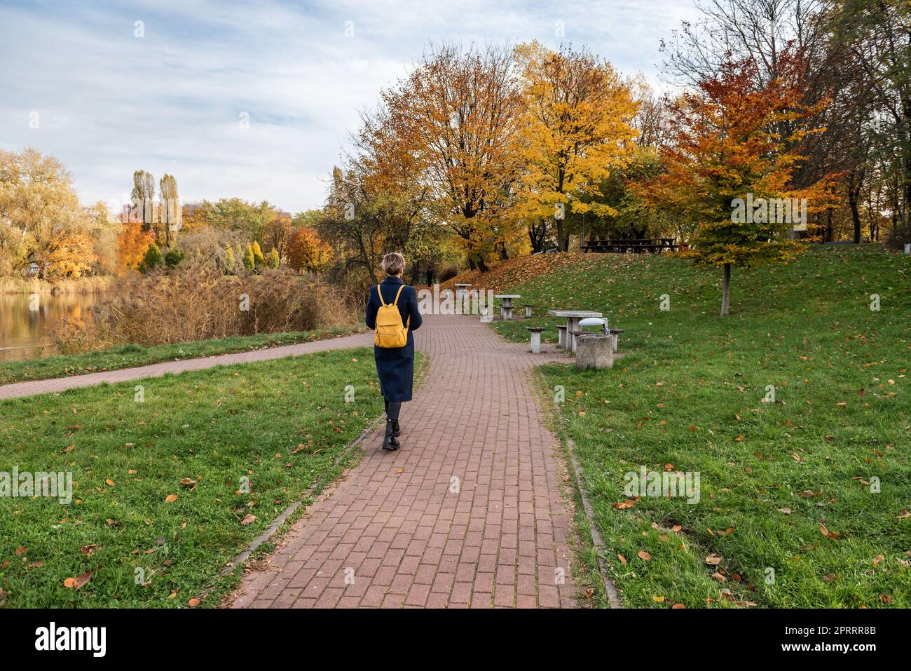 Young blond woman walks away hi-res stock photography and images - Alamy
