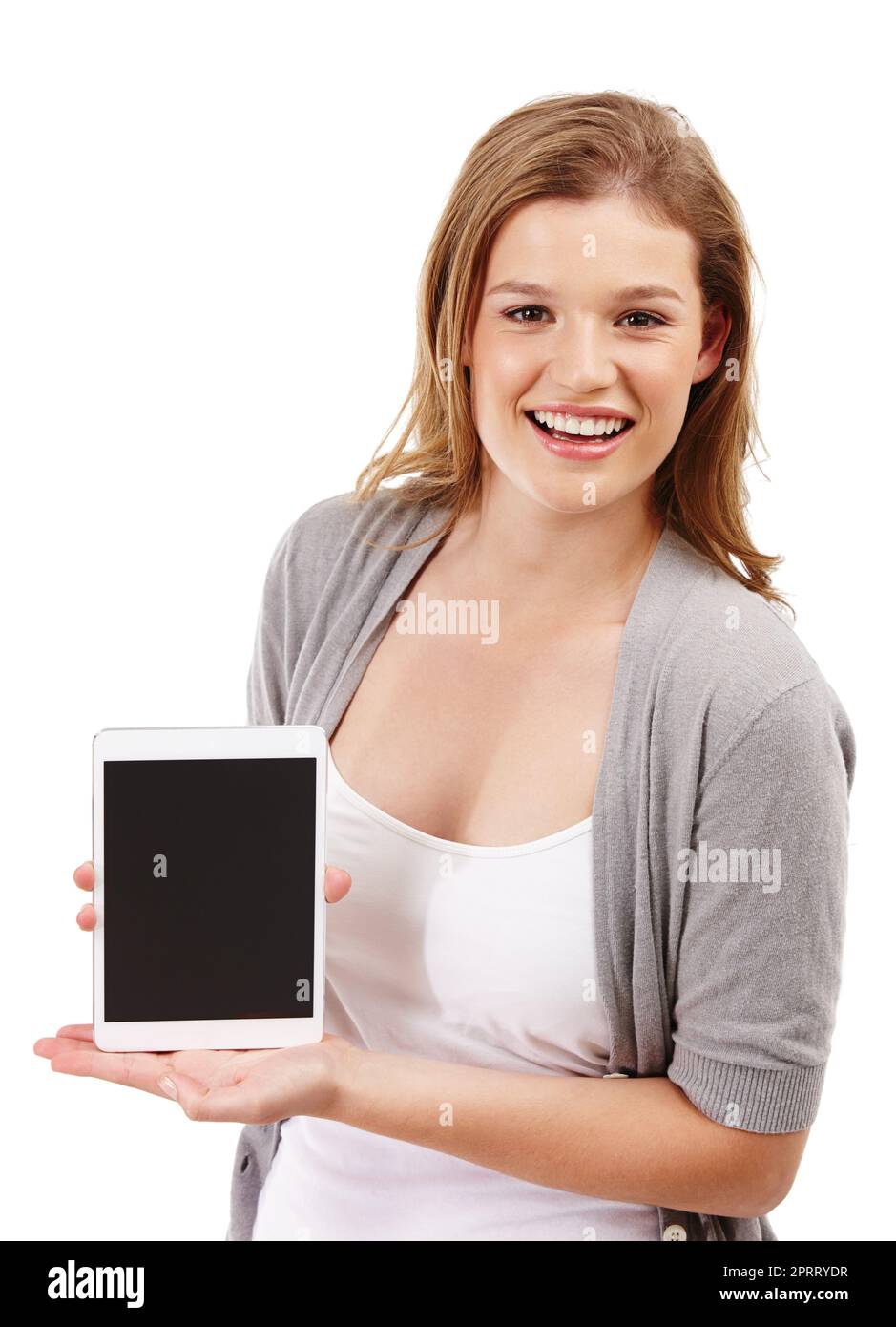 The latest in tablet technology. Studio portrait of an attractive young woman holding up a digital tablet against a white background. Stock Photo