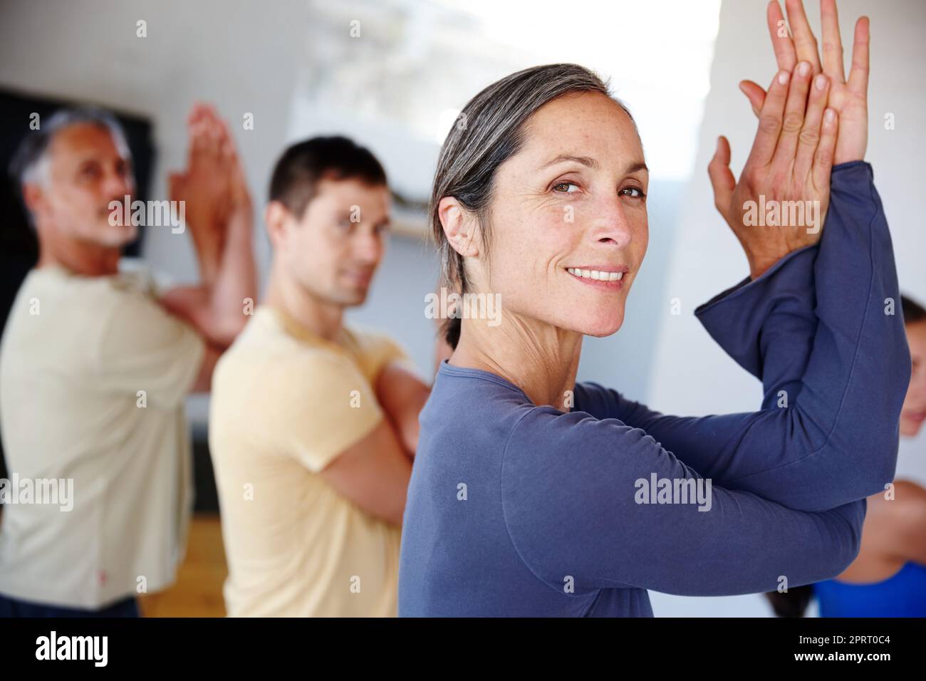 Healthy bodies are built here. A group of people taking a class together at gym. Stock Photo