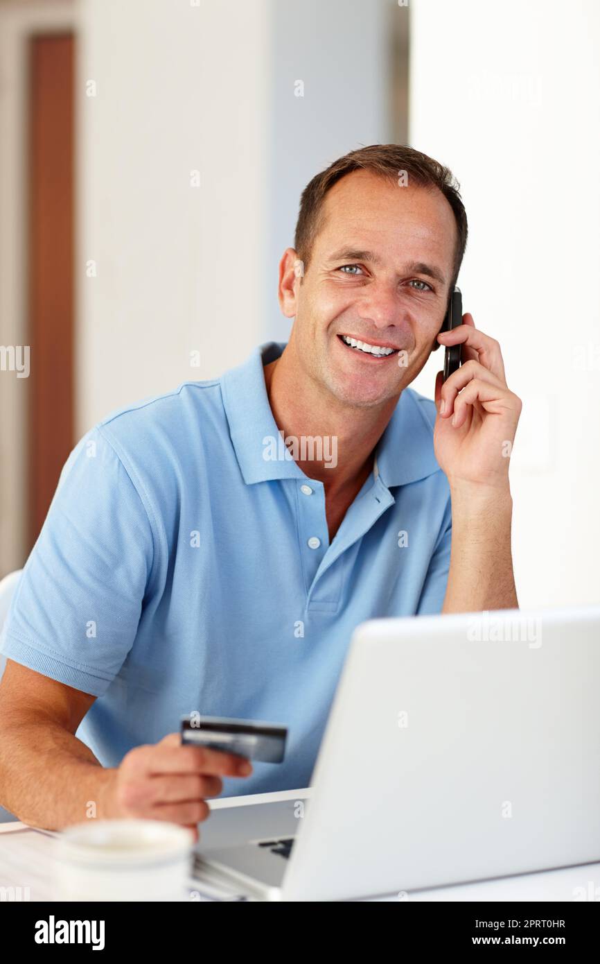 Working hard to get the deal done. a busy mature man making phone calls. Stock Photo