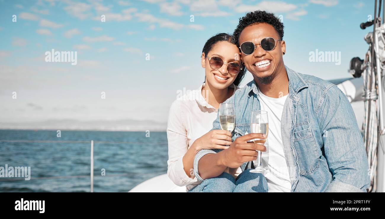 Couple with sunglasses on luxury yacht travel, champagne outdoor rich experience and ocean summer holiday. Young woman happy on vacation, man with rich smile and wealth lifestyle at sea together Stock Photo