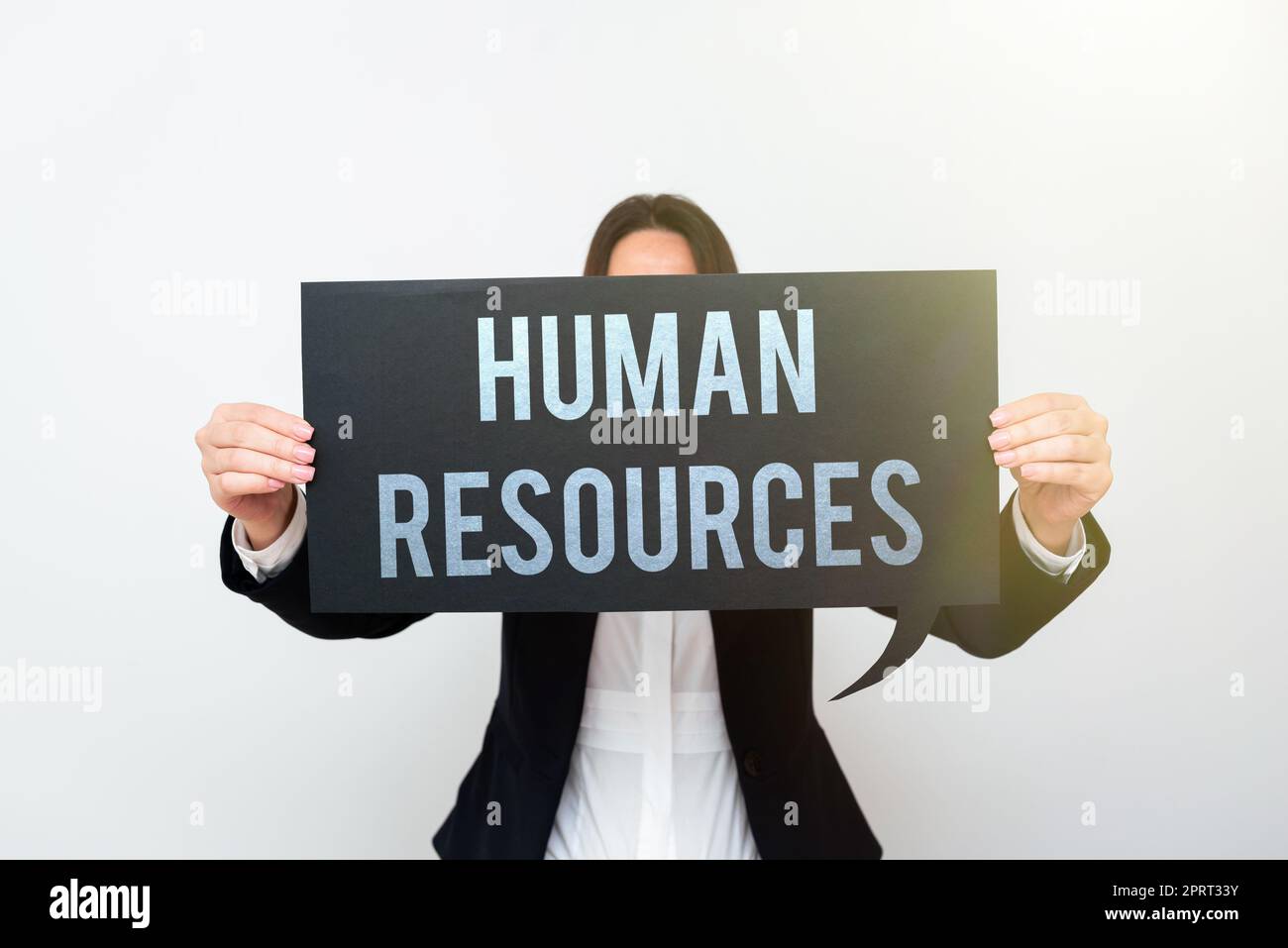 Hand writing sign Human ResourcesThe people who make up the workforce of an organization. Word Written on The showing who make up the workforce of an organization Stock Photo