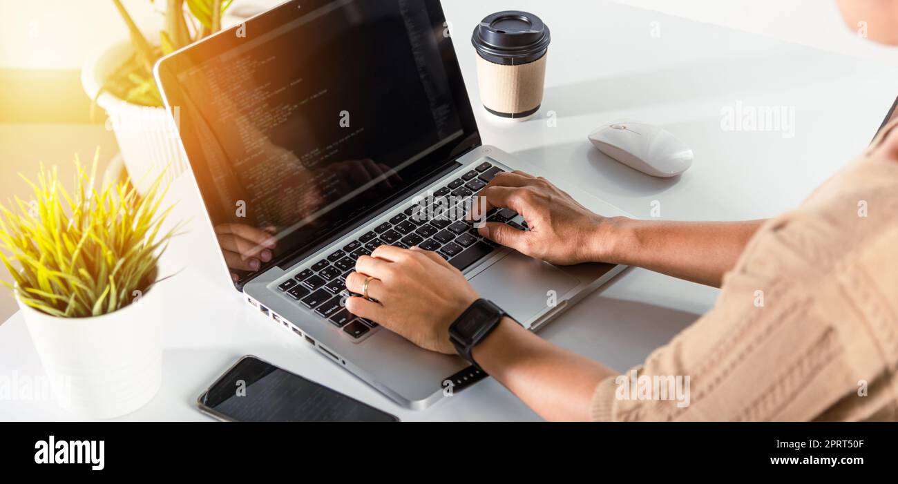 Programmer woman writing program HTML code sitting at workplace in ...