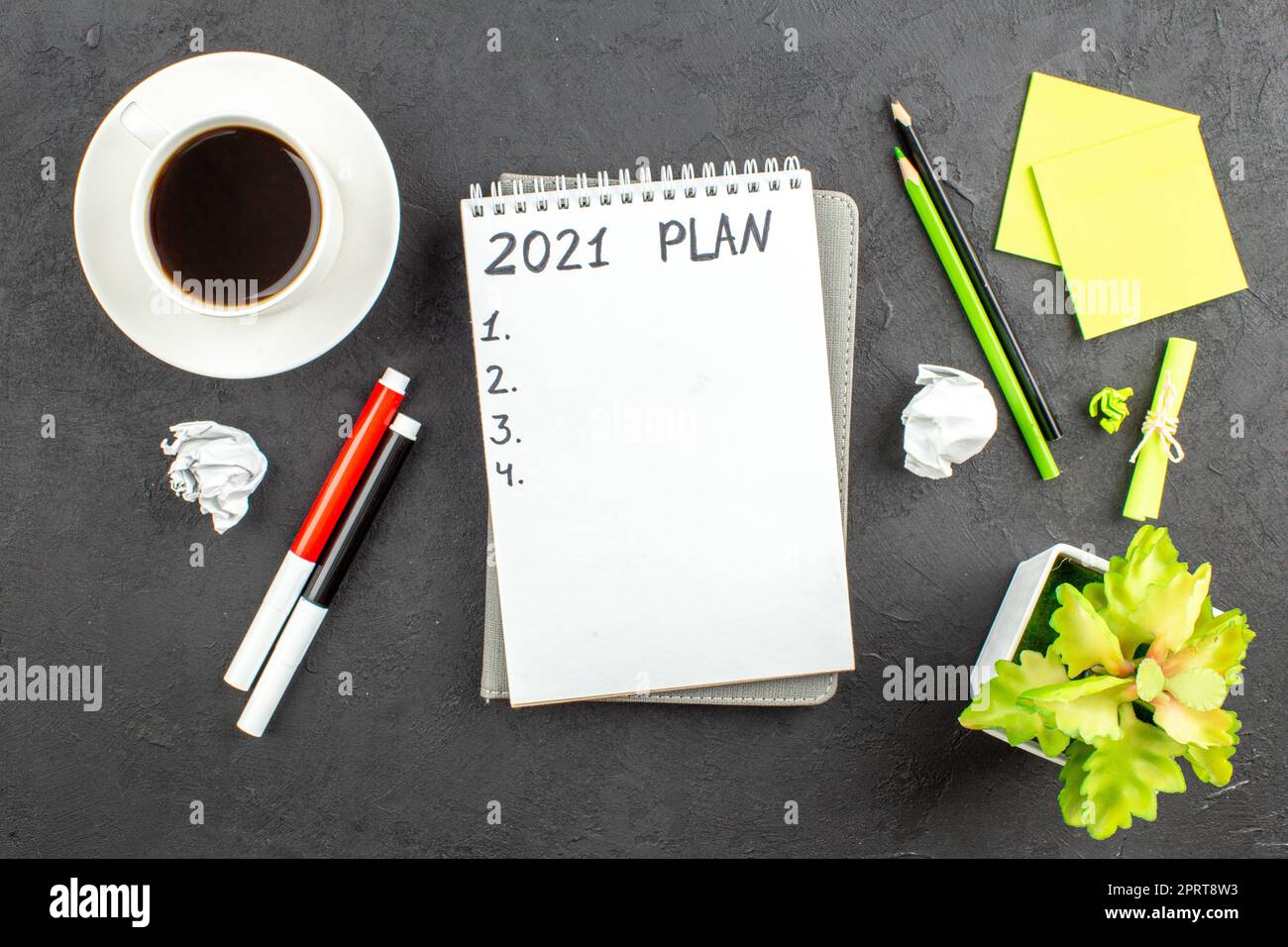 top view plan written on notepad red and black markers green and black ...