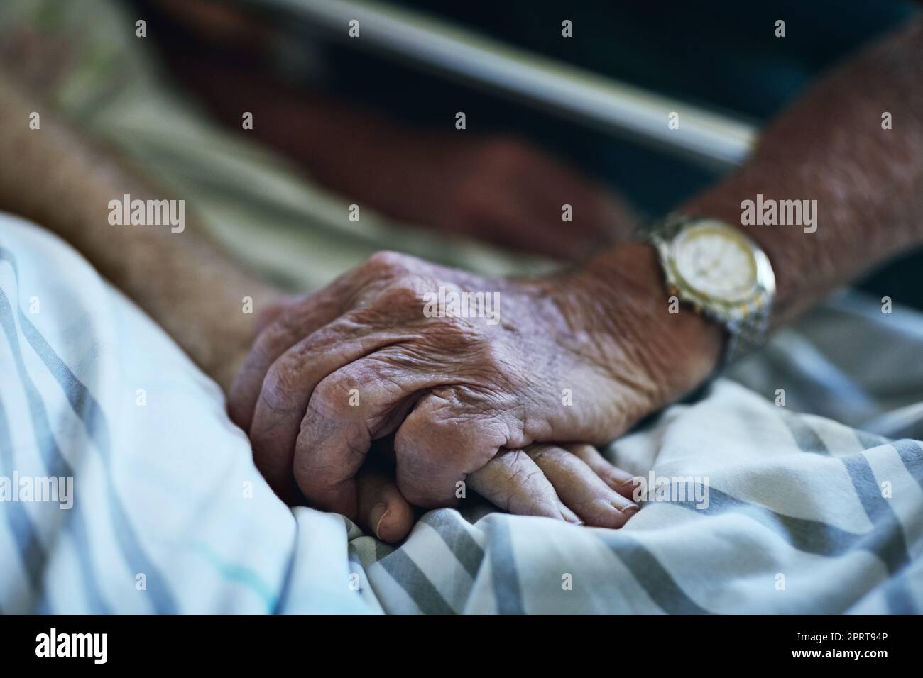 Caring is just another word for love. a senior man visiting his wife in