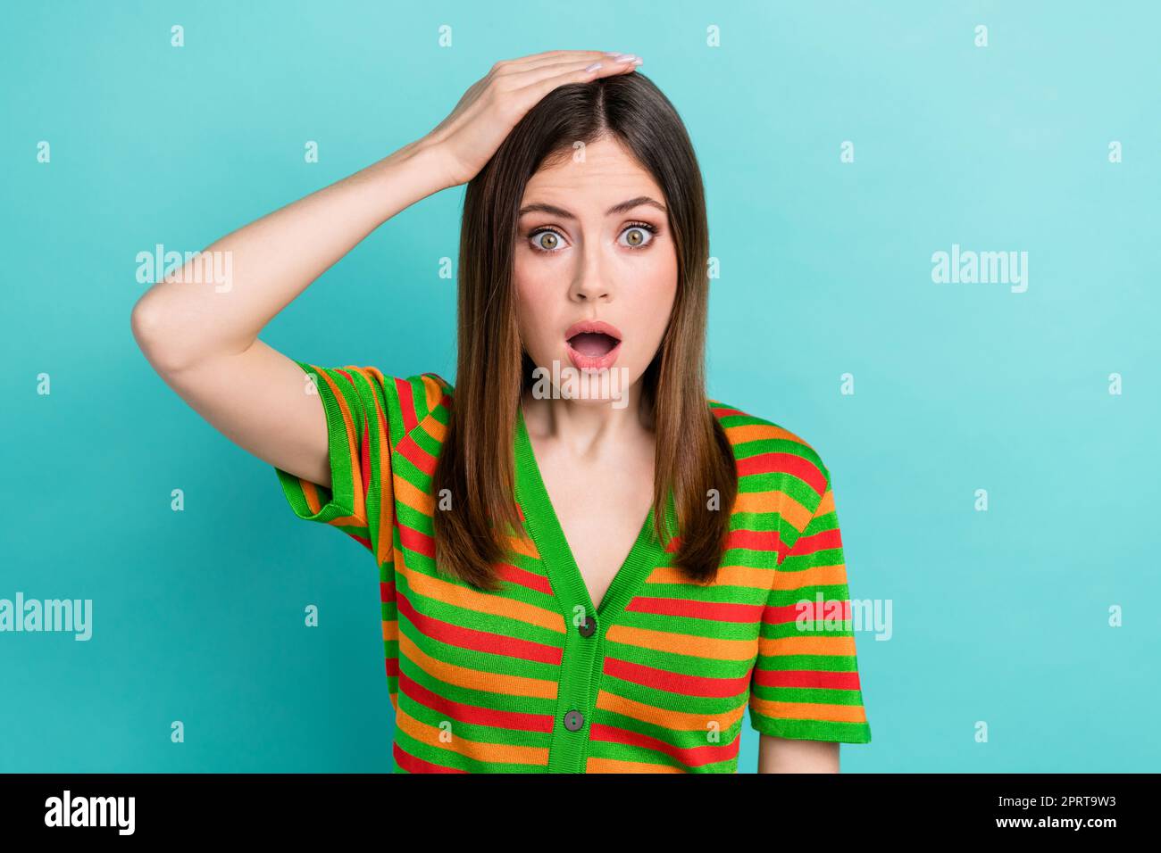 Photo of cute impressed woman dressed striped cardigan arm head open mouth  isolated teal color background Stock Photo - Alamy