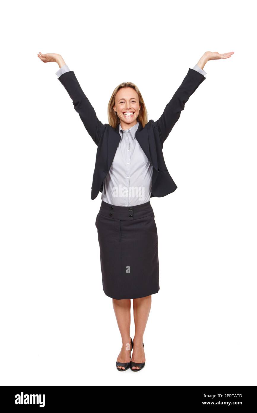 That made my day. Studio portrait of an excited businesswoman standing with her arms outstretched against a white background. Stock Photo