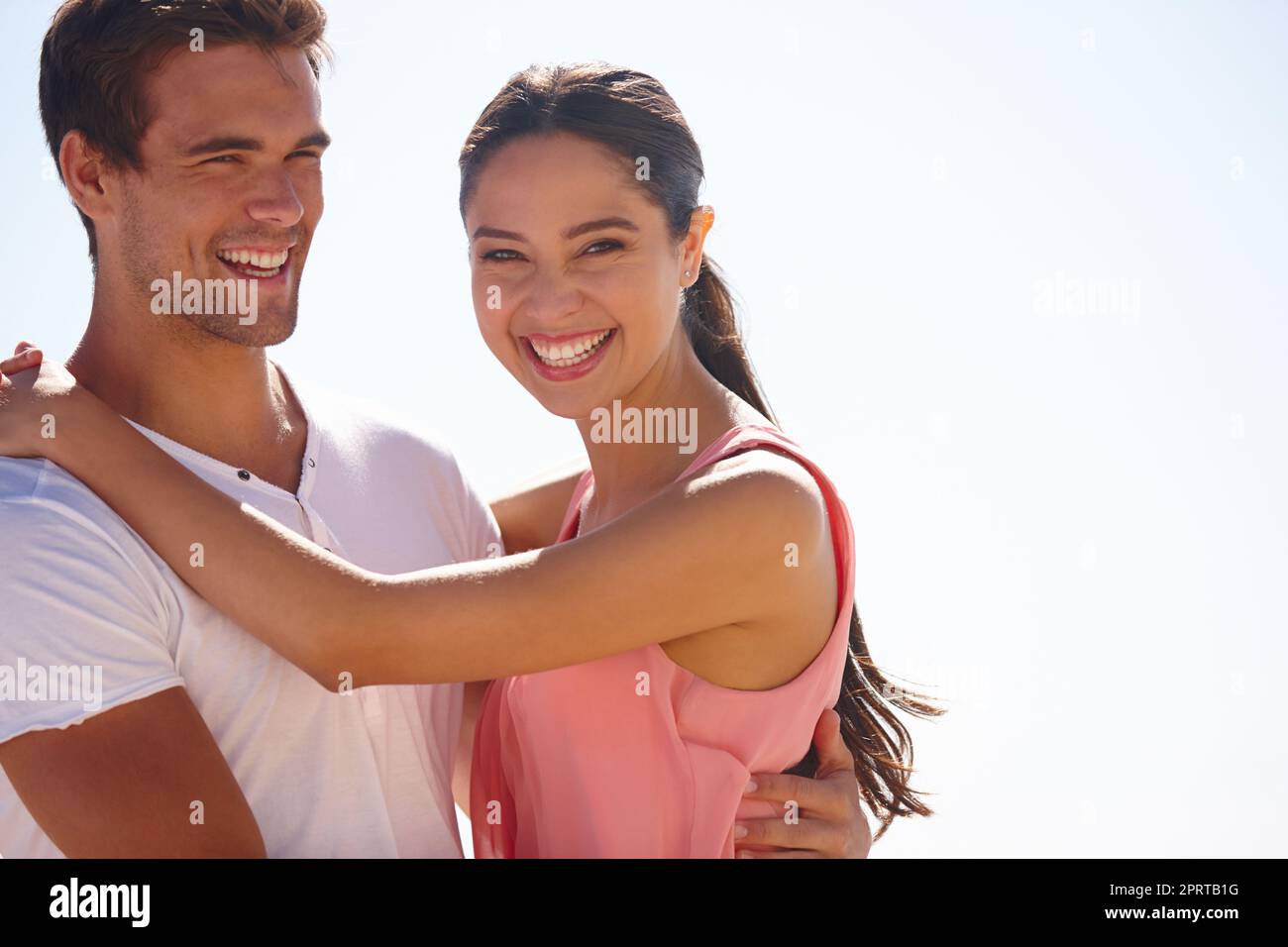 Love makes a day seem brighter. a young couple outdoors. Stock Photo