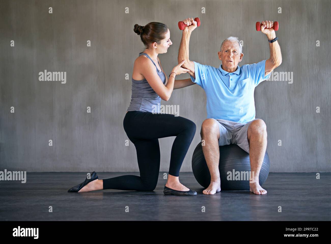 On the long road to recovery. a a physical therapist working with a senior man. Stock Photo