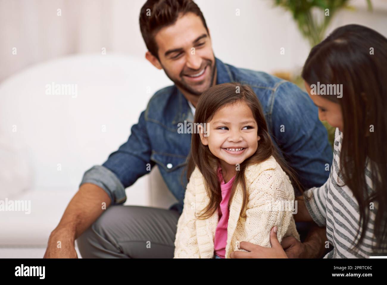 Theres an abundance of love in this home. a happy family spending quality time together at home. Stock Photo
