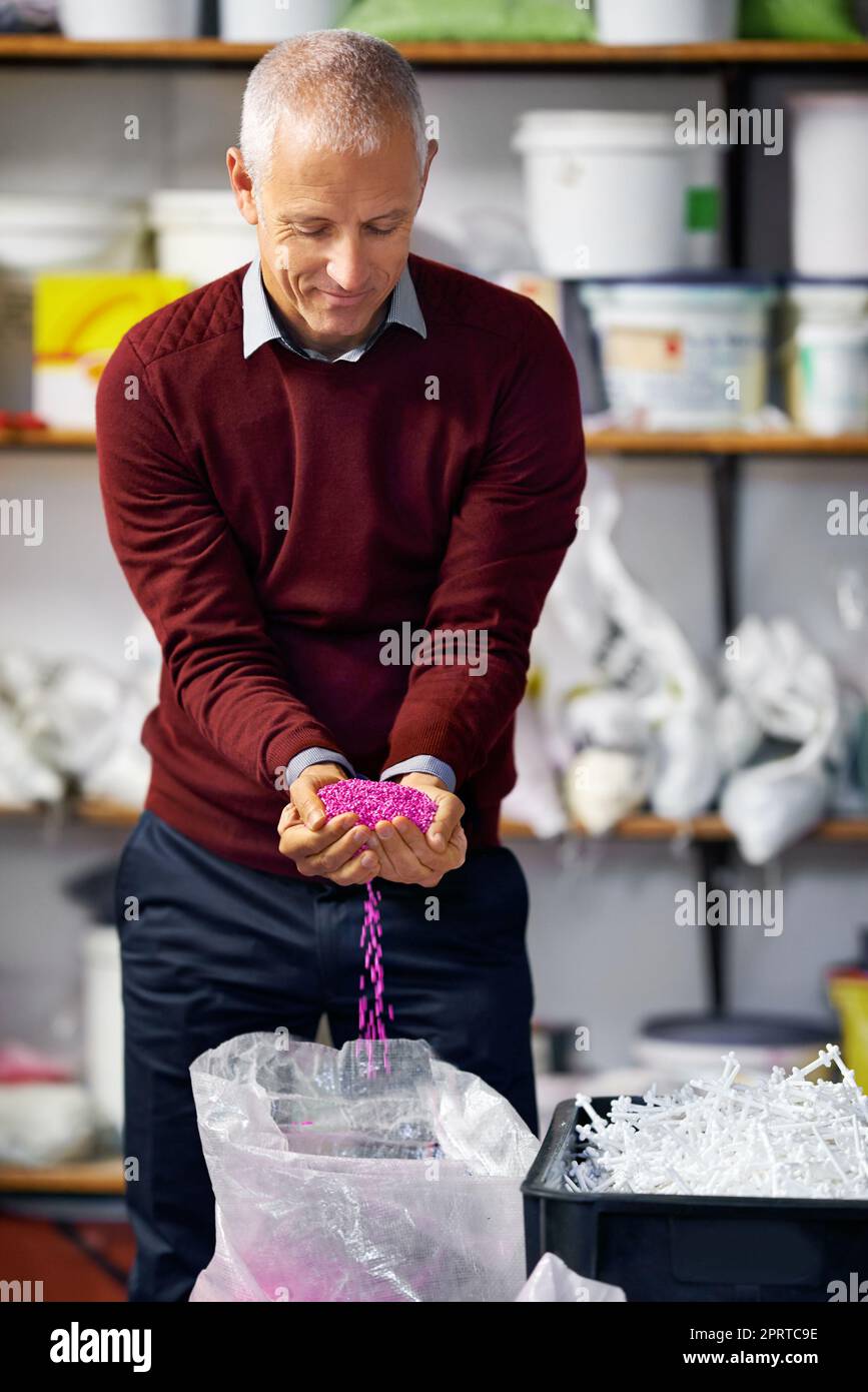 Looks perfect. A plastics factory owner speculating his merchandise. Stock Photo