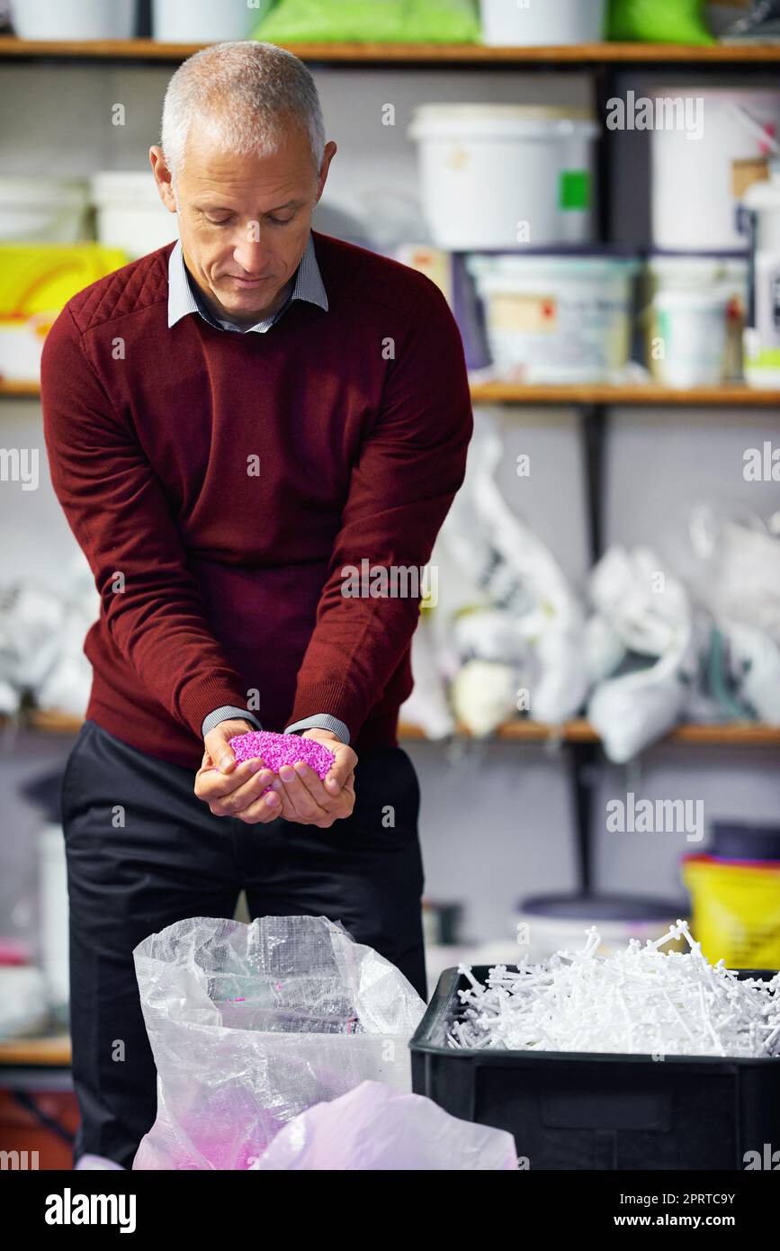 Plastics for your every need. A plastics factory owner speculating his merchandise. Stock Photo