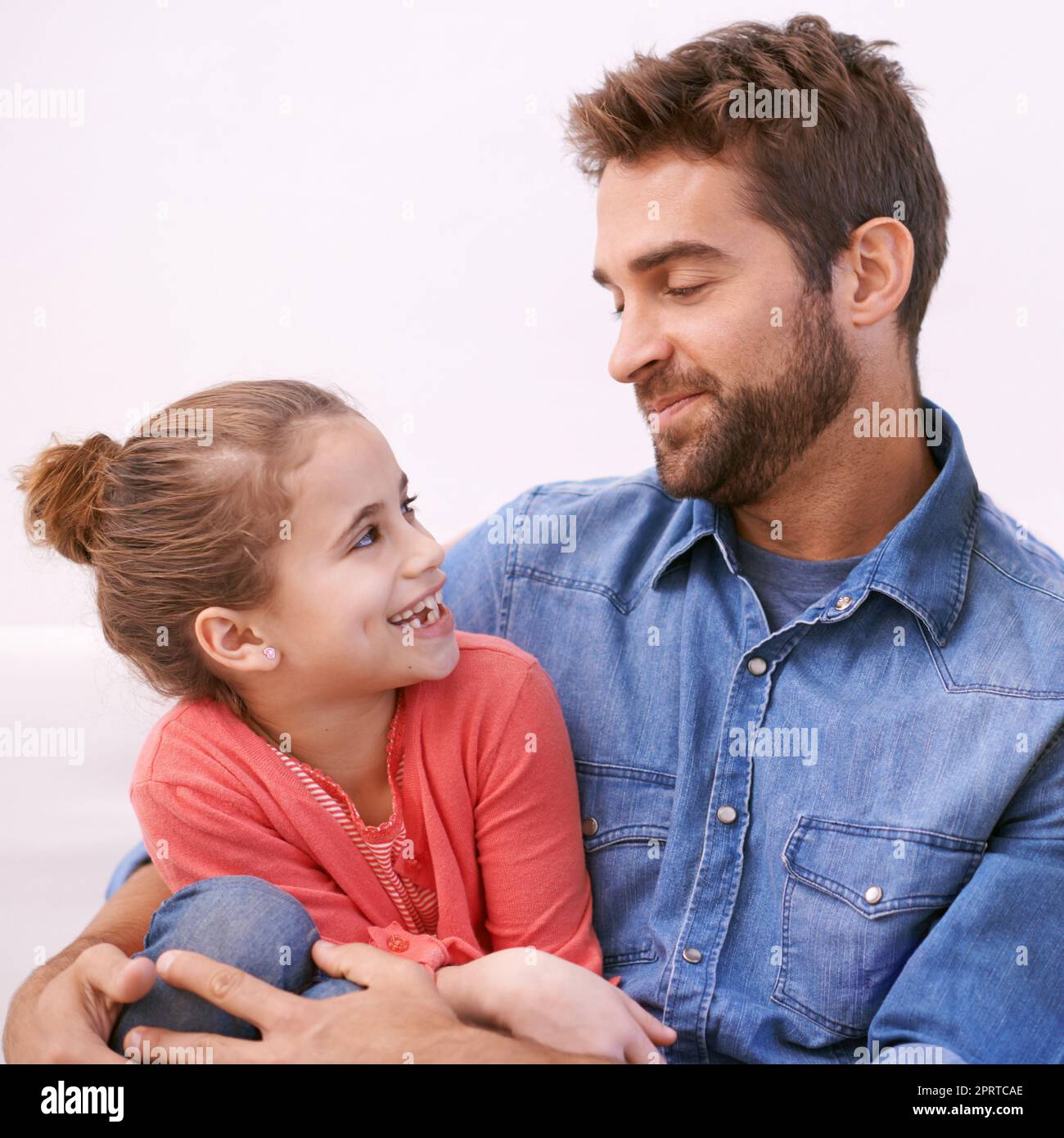 She knows just how to get her way. a handsome man spending time with his daughter. Stock Photo