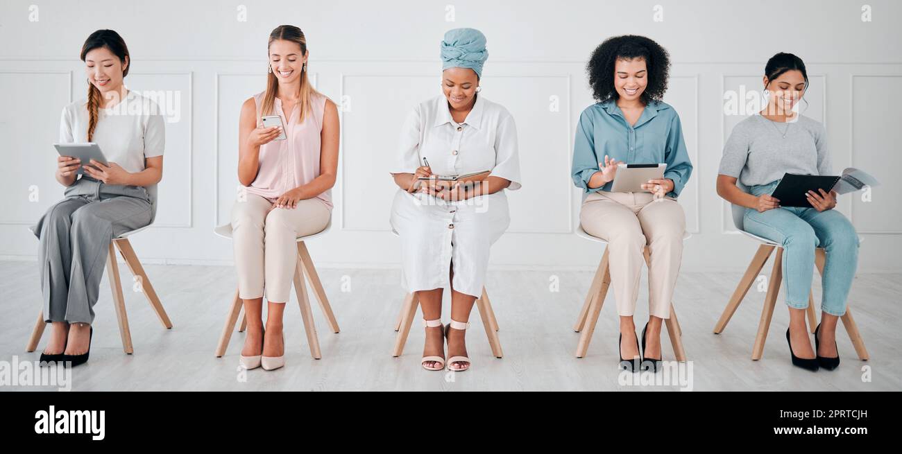 Business women multimedia planning for recruitment, career goal and creative marketing strategy with diversity. Corporate people with notebook, smartphone and document in a job interview waiting room Stock Photo