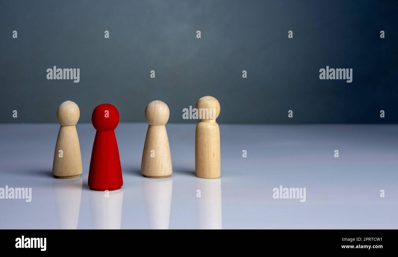 concept Business and HR for leadership and team leader, one wooden dolls stand out in front  Different and stand out from the group Stock Photo