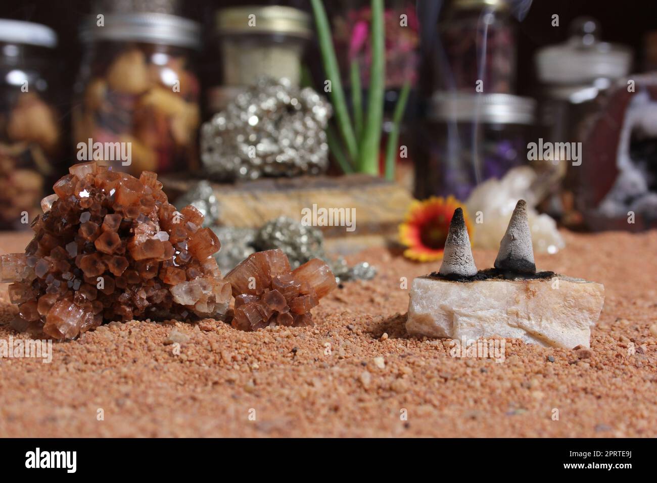 Chakra Stones With Aloe Vera and Incense Cones on Australian Red Sand Stock Photo