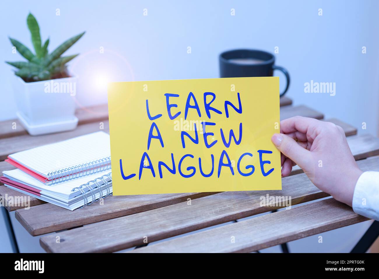 Hand writing sign Learn A New Language, Business approach Study Words other than the Native Mother Tongue Stock Photo