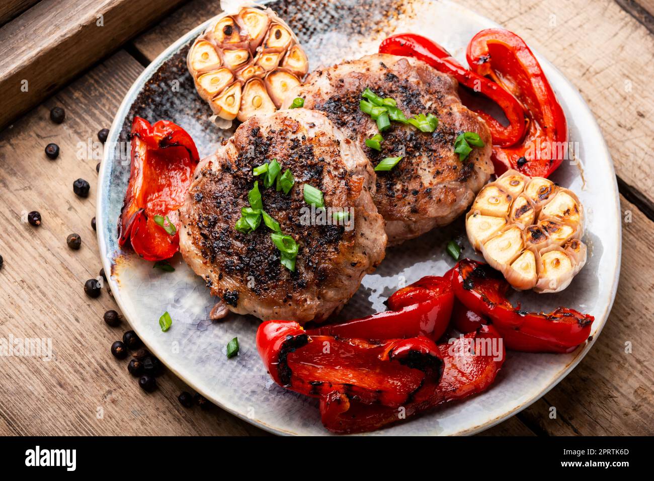 Fried beefsteak in bacon Stock Photo