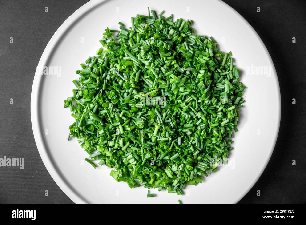 Fresh cut chives on a plate Stock Photo
