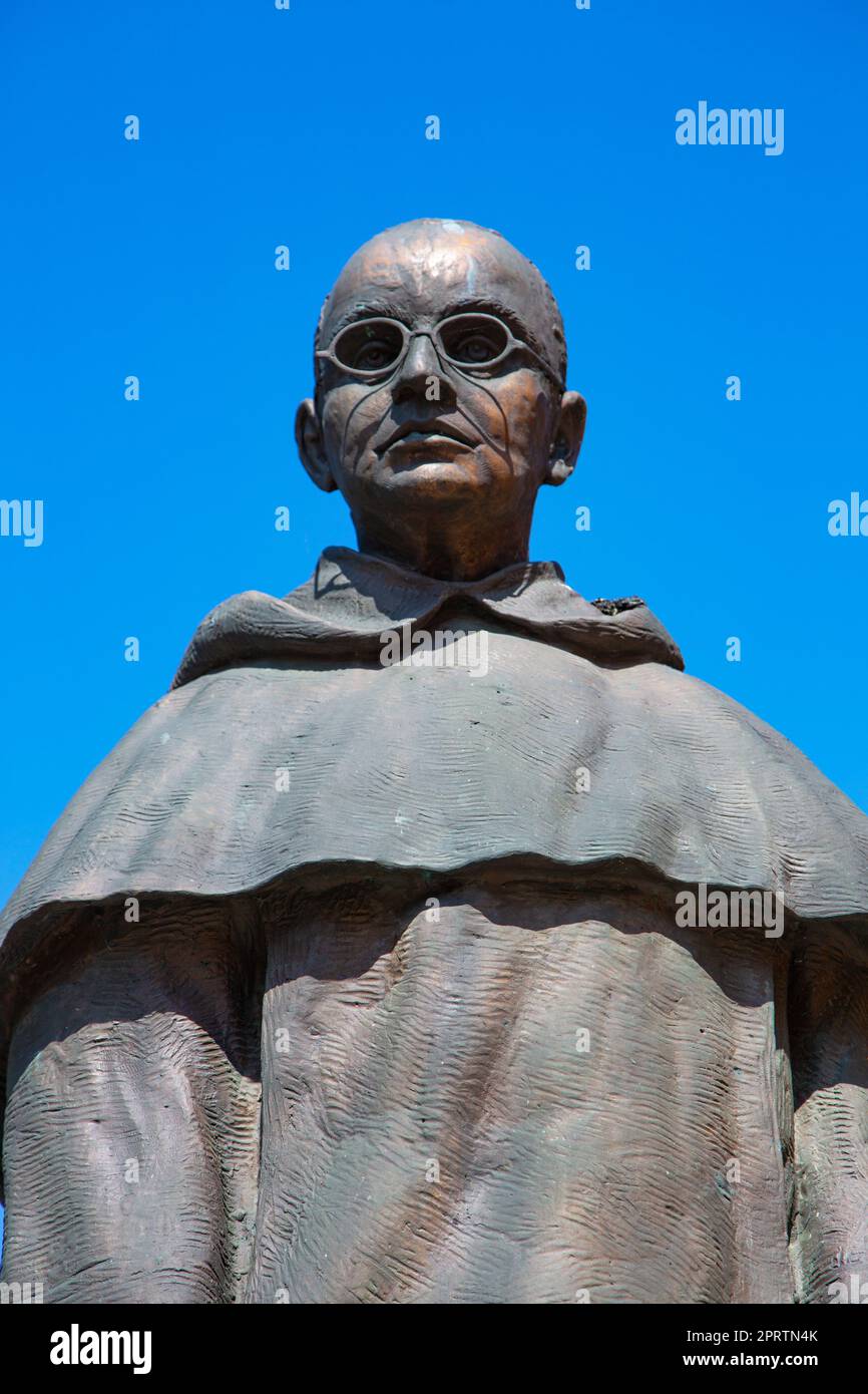 bronze statue of a catholic priest Stock Photo Alamy