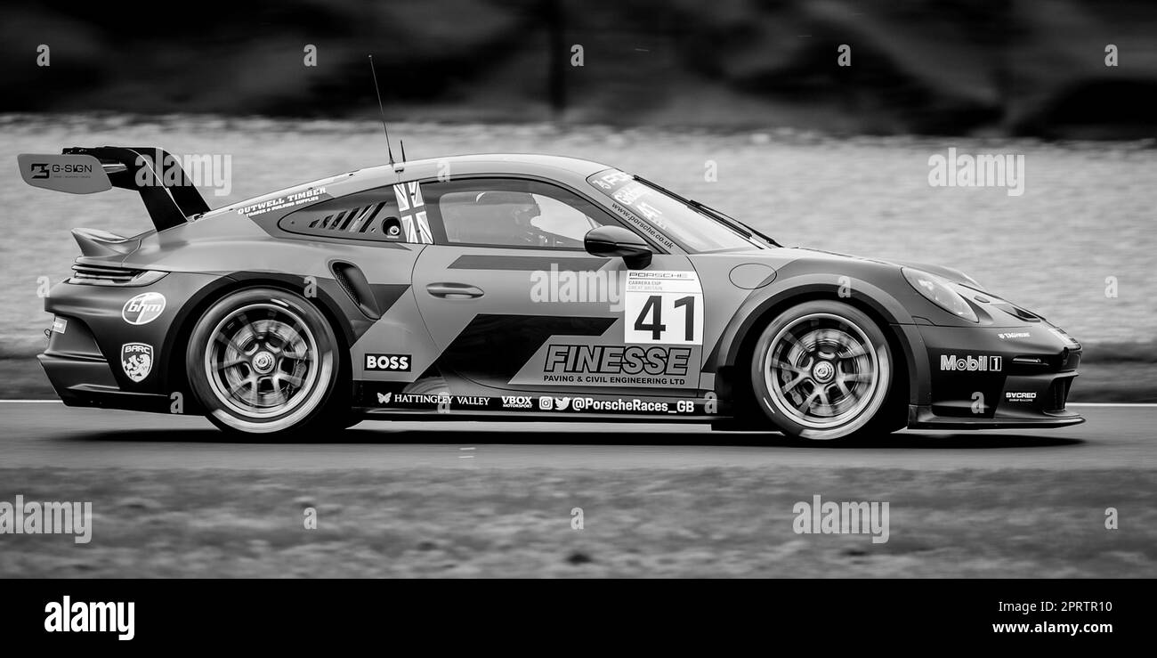 Black and White image of a Porsche Carrera Racing Car Stock Photo