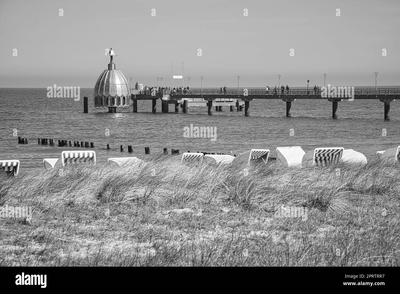 on the coast of the baltic sea on zingst. the pier and the groynes that reach into the water. Stock Photo