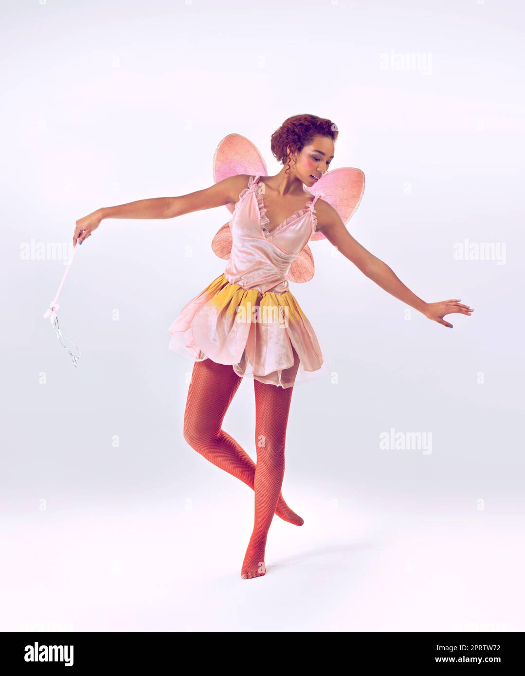 Dance of the fairy. A full length shot of a cute fairy dancing. Stock Photo