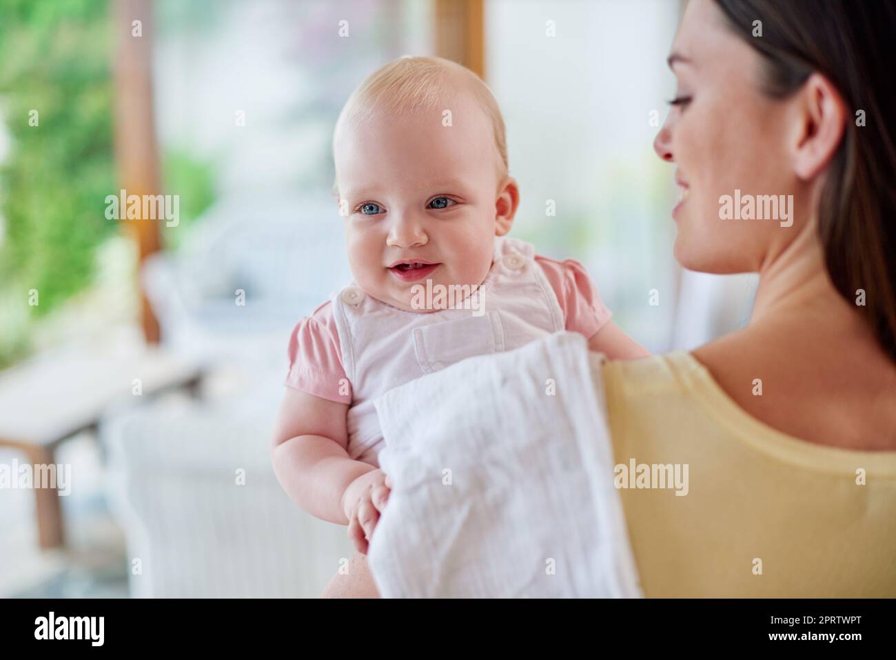 I think you need to be burped...Over the shoulder shot of a mother