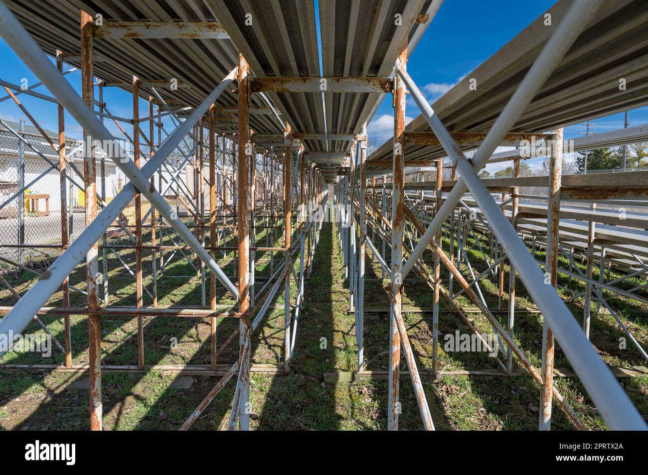 Underside of bleachers showcasing the beams, supports, and bracing elements that hold the