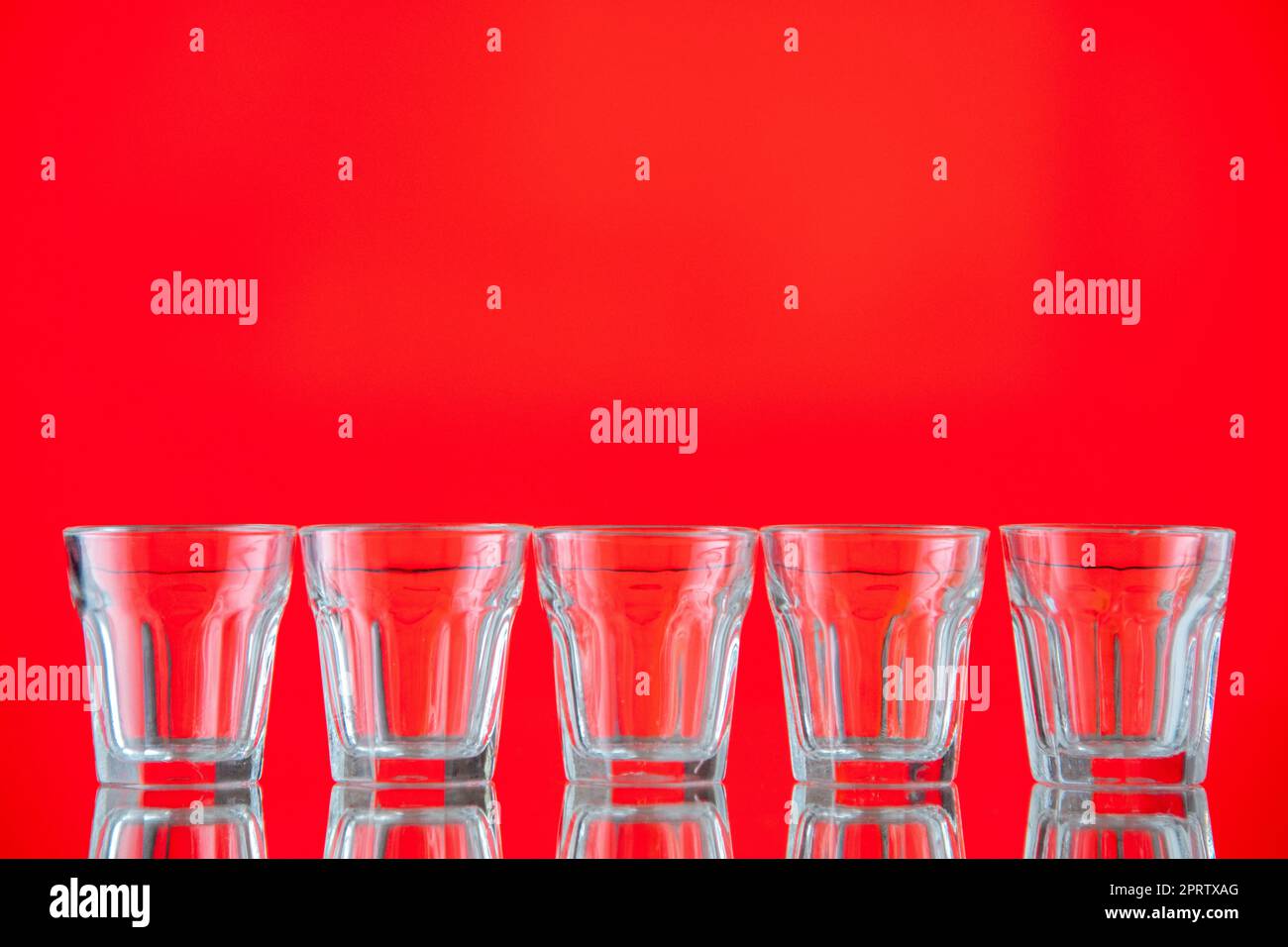 front view water glasses isolated on red background free space Stock ...